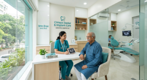 An elderly patient smiling warmly during a consultation with a compassionate geriatric dentist in Dhakuria at Chhaya Dental & Implant Care.